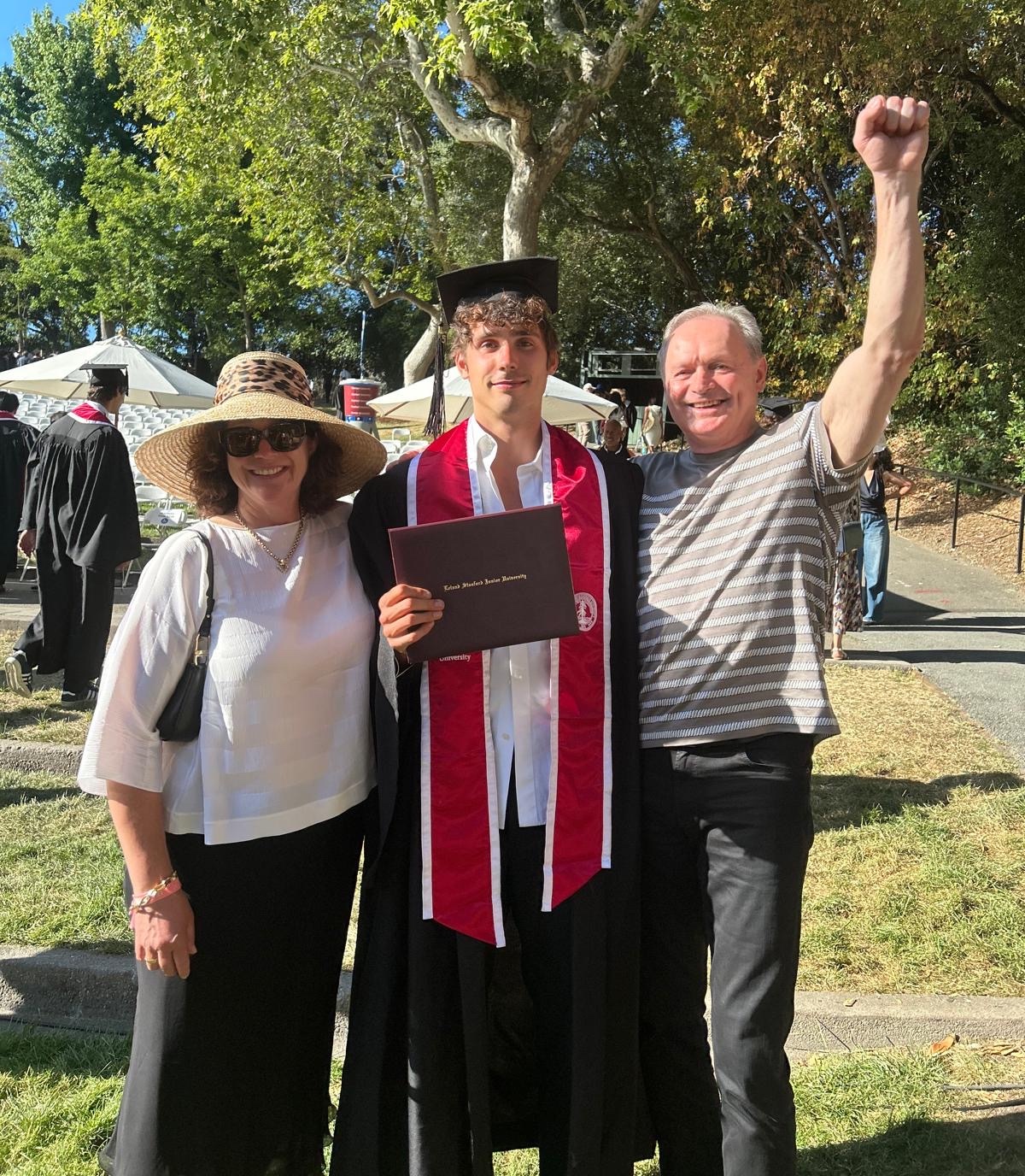 Finn with his parents at Stanford graduation