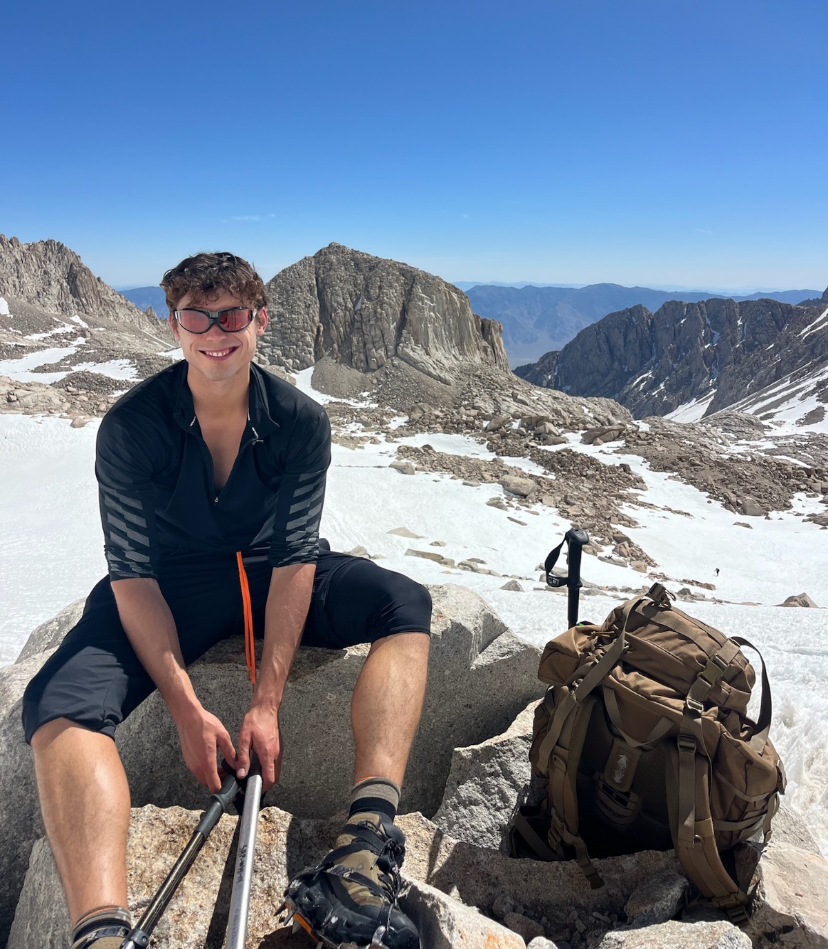 Finn at a mountain summit while hiking